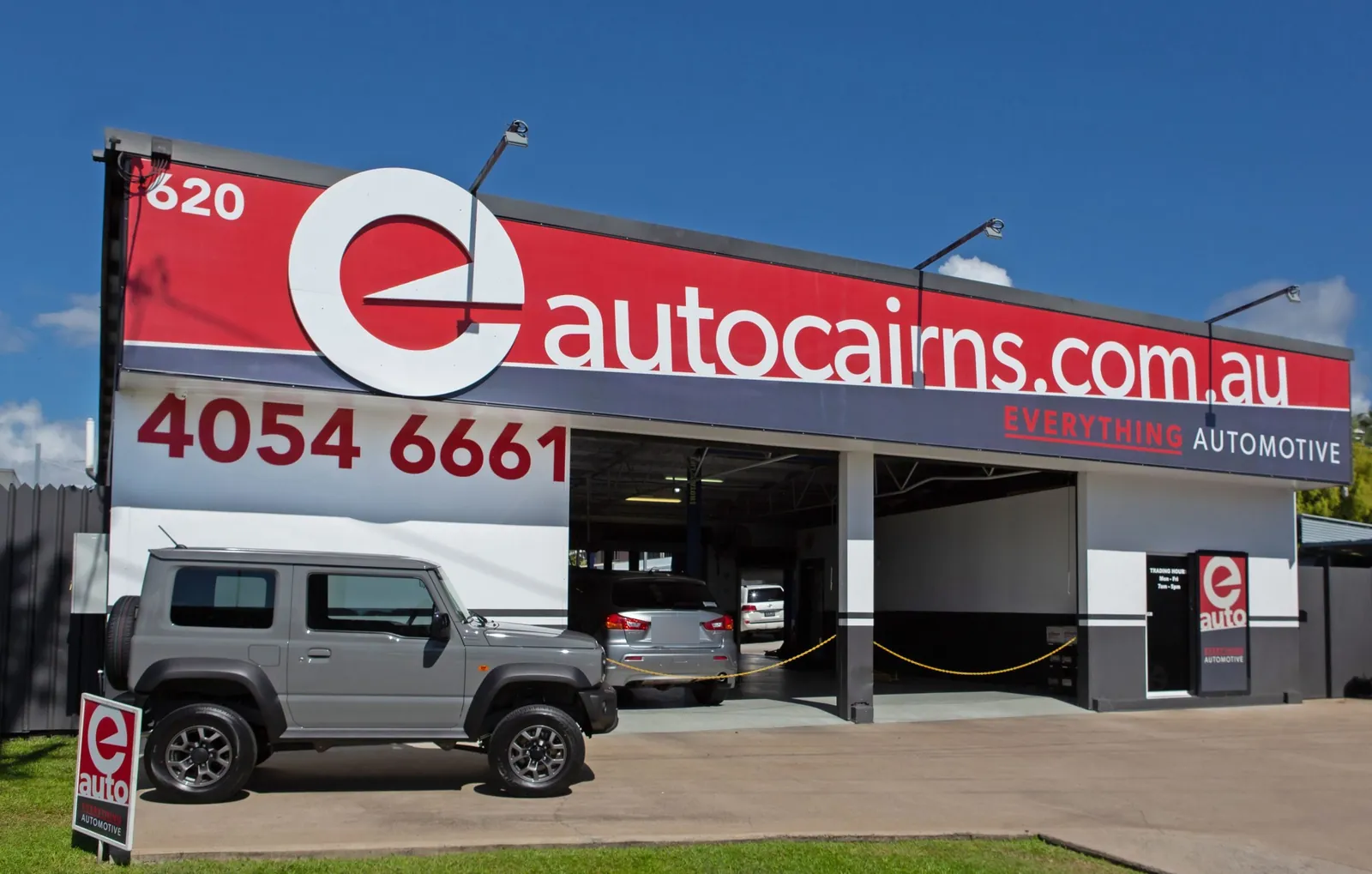 The Everything Automotive workshop at 620 Bruce Highway, Woree: red eautocairns.com.au signage above open service bays